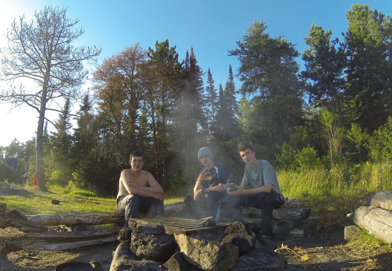 Enjoying dinner around the fire.